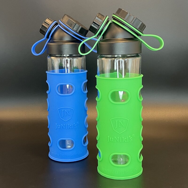 Set: 2 x JuNikis Wrstchen cap + 2 silicone sleeves and cap holder green and blue